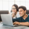 Couple Looking At Computer